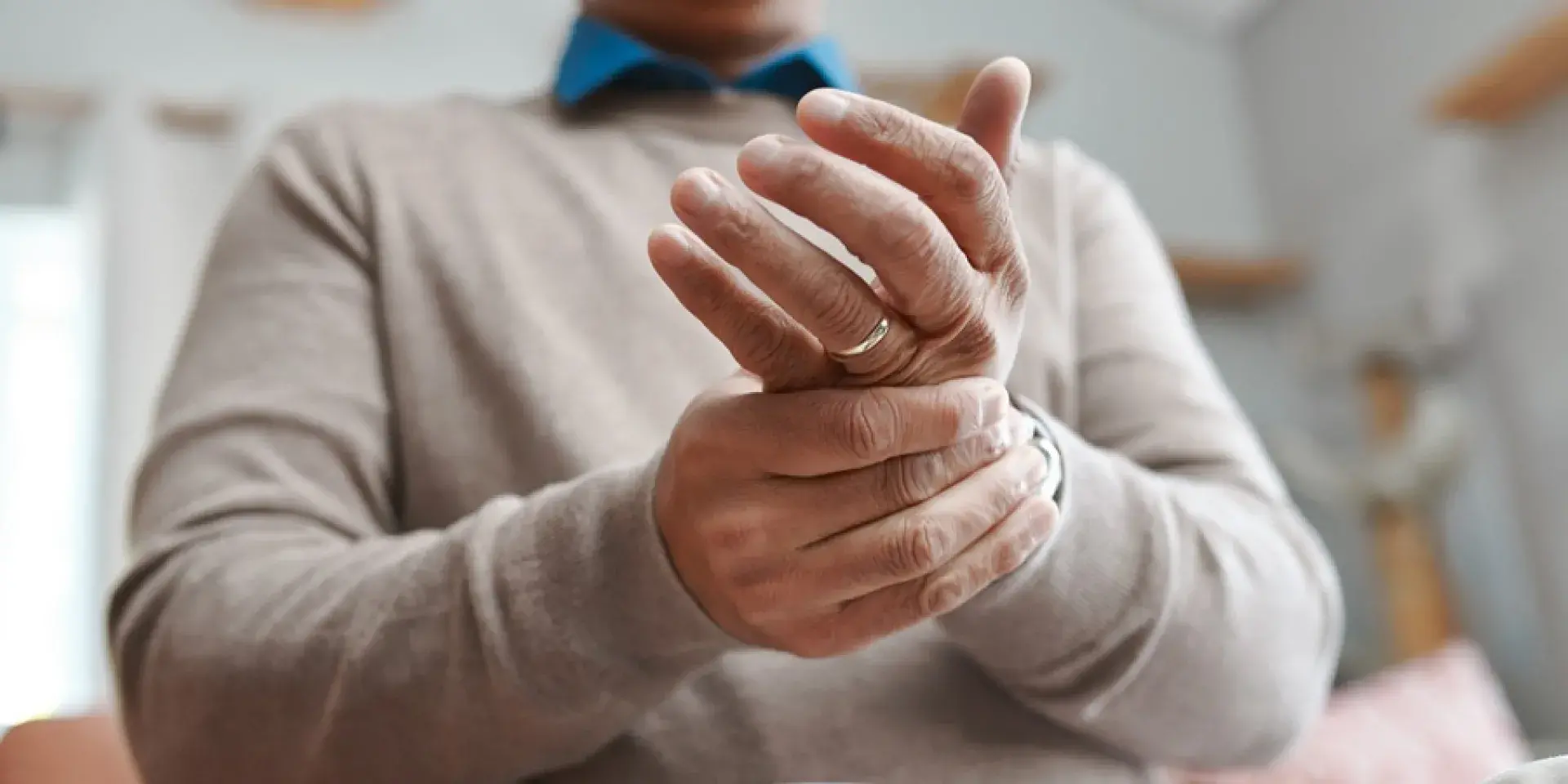 Man massaging wrist