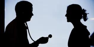 Silhouette of doctor and patient