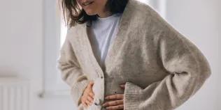 Woman holding stomach