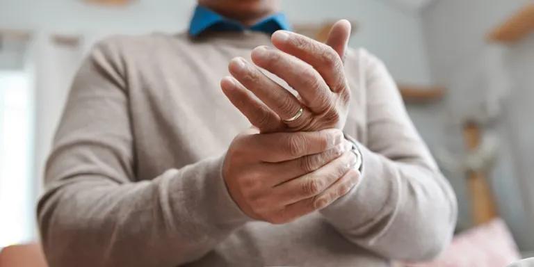 Man massaging wrist