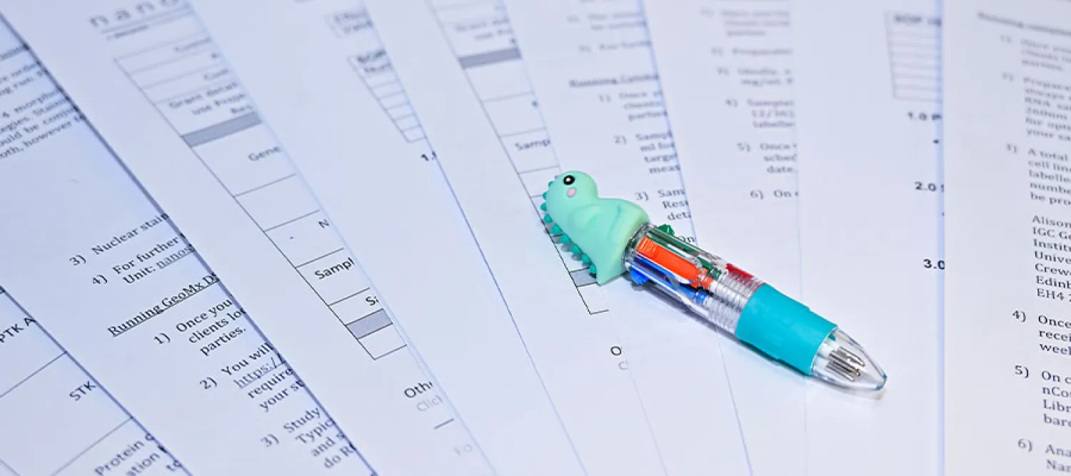 A pen laying on sheets of notes