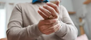 Man massaging wrist