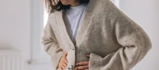 Woman holding stomach