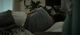 person lying in a bed