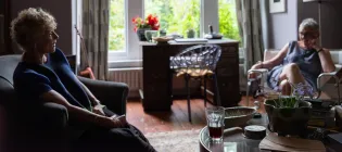 two women sitting in a living room