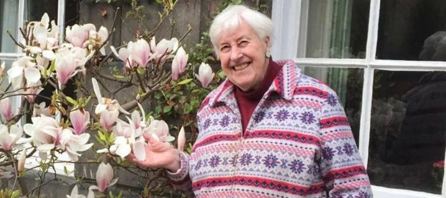 Ann Chandley outside her house