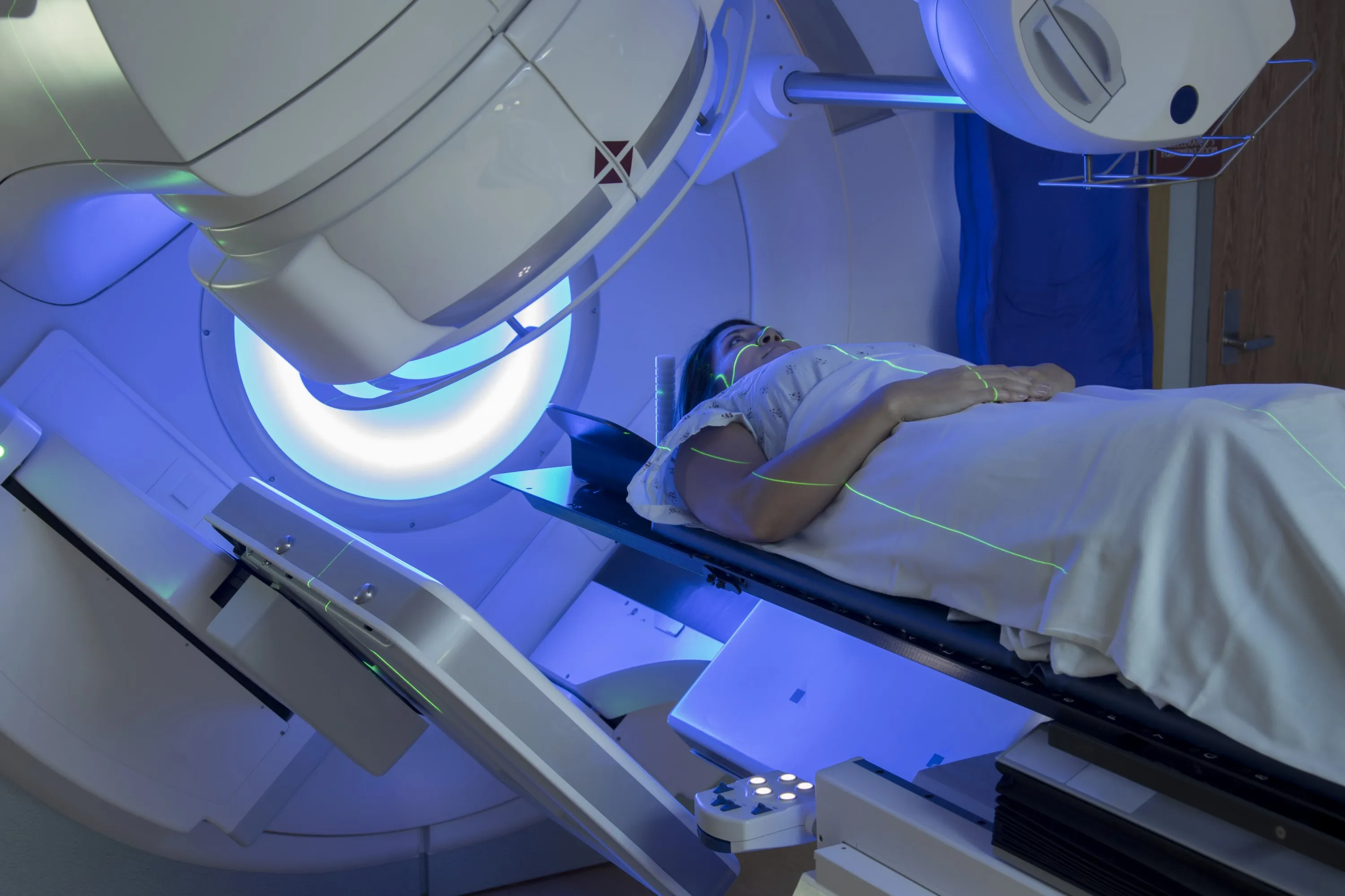 Woman receiving radiotherapy treatment for breast cancer
