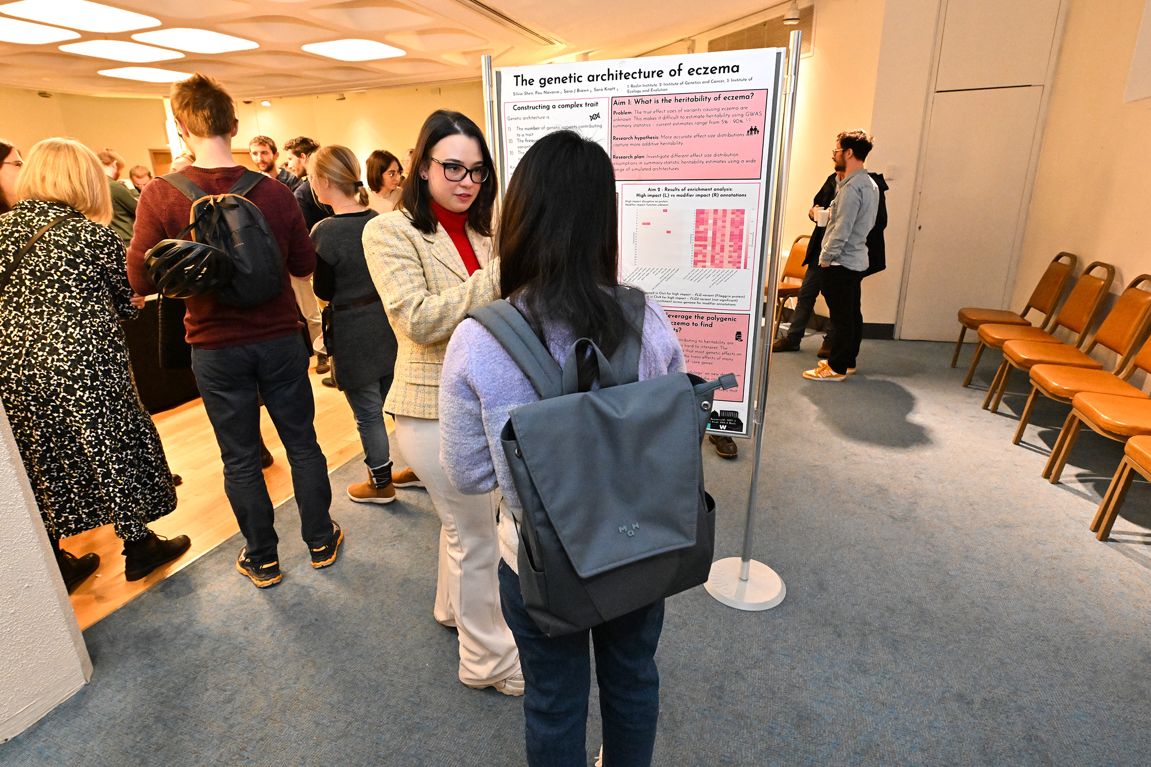 Silvia Shen discussing her poster board