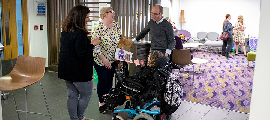 Researcher speaking with patients