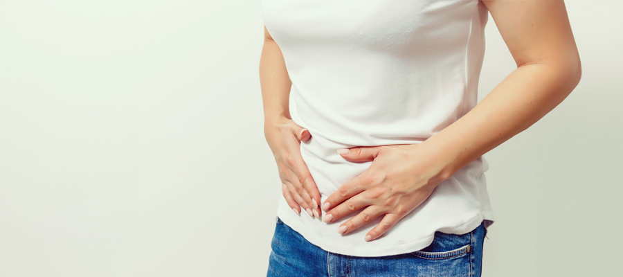 Ovarian Cancer - woman holding stomach